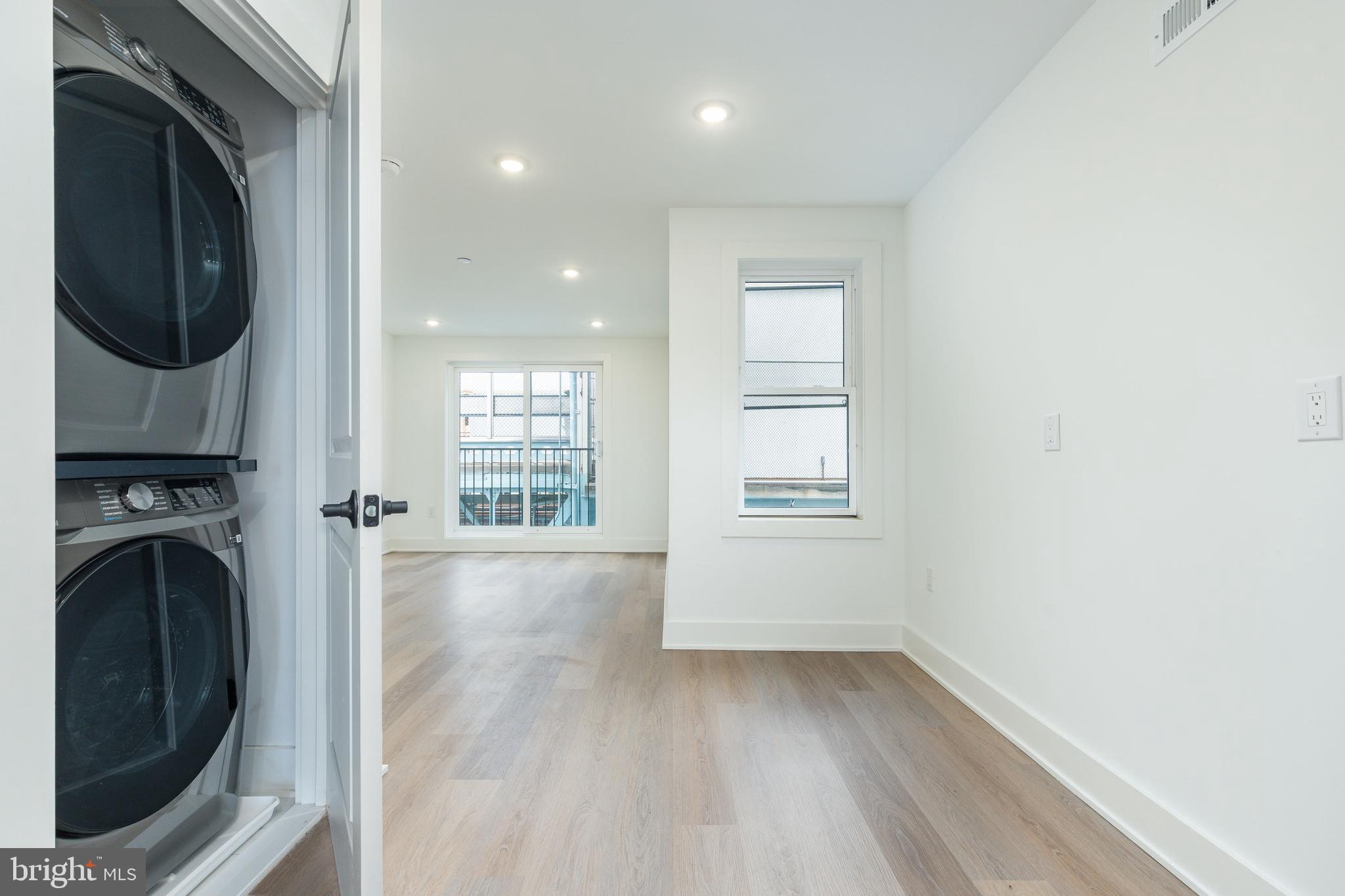 2252 North Front Street, Unit 2 Philadelphia, PA 19133 - Photo 10 of 15 a view of a hallway with washer and dryer