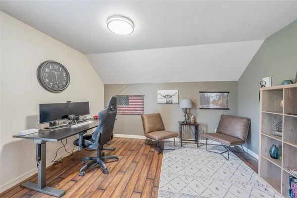 a work room with furniture and a clock
