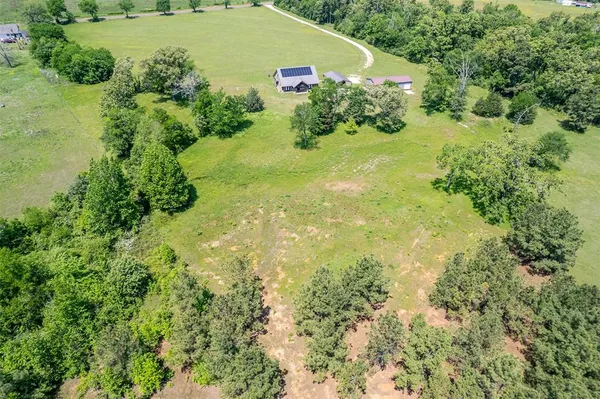 a view of a garden with a building
