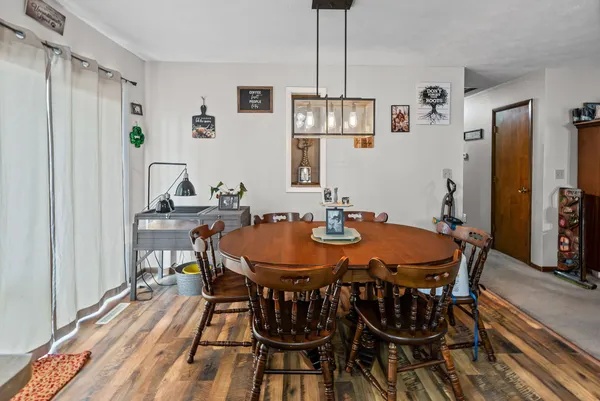 a dining room with furniture and window