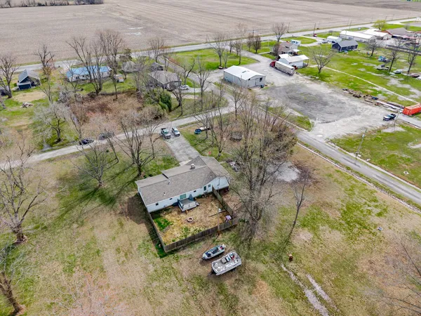 a view of a yard with an outdoor seating