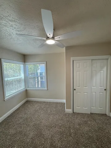 a view of room with window and hardwood floor