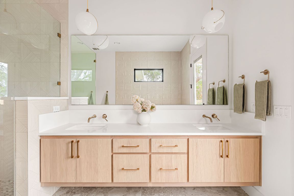 2607 Richcreek Road Austin, TX 78757 - Photo 18 of 40 a bathroom with a sink vanity and mirror