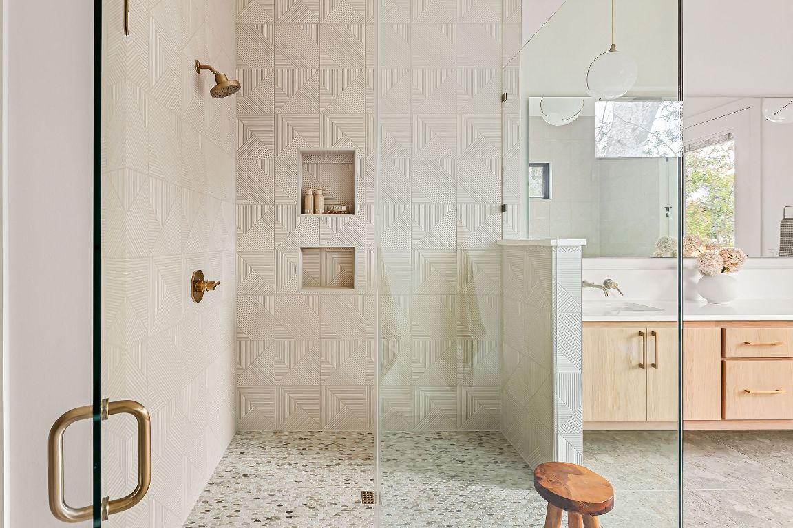 2607 Richcreek Road Austin, TX 78757 - Photo 20 of 40 a bathroom with a granite countertop sink a toilet and shower