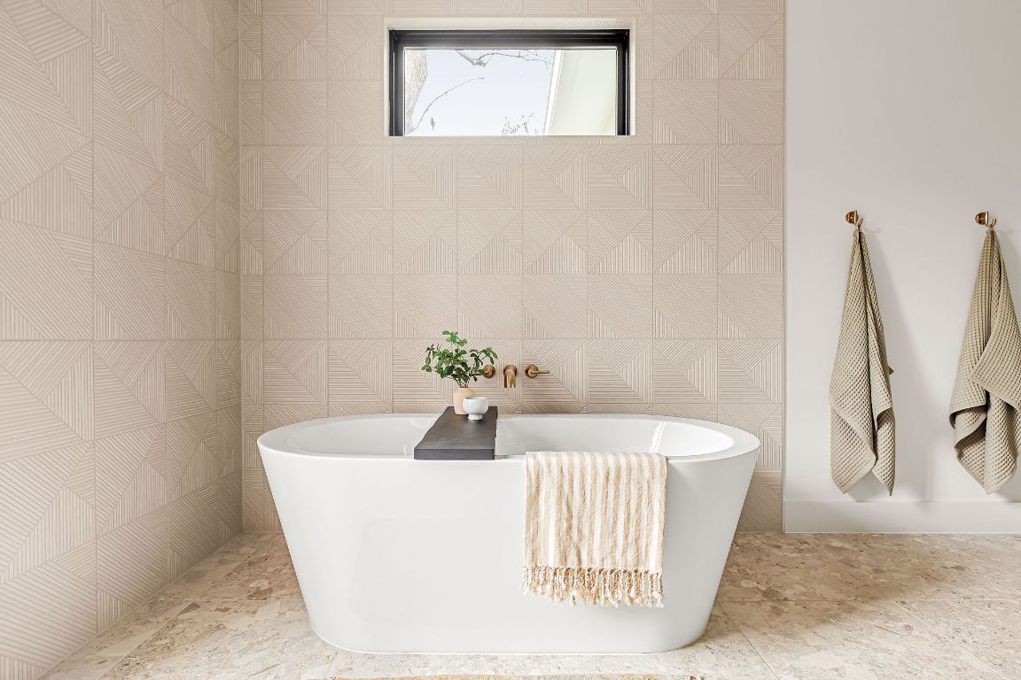 2607 Richcreek Road Austin, TX 78757 - Photo 21 of 40 a white bath tub sitting in a bathroom