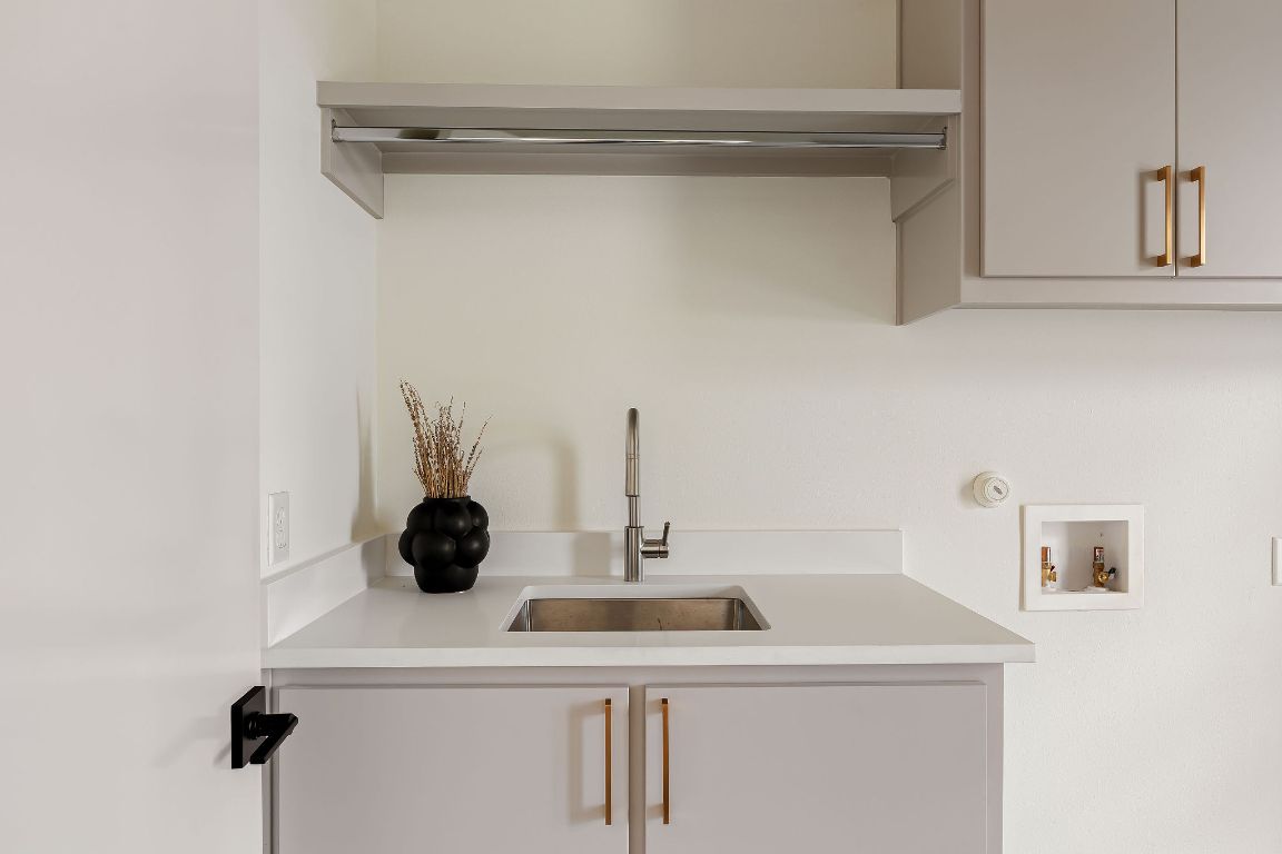 2607 Richcreek Road Austin, TX 78757 - Photo 32 of 40 a bathroom with a sink and a mirror