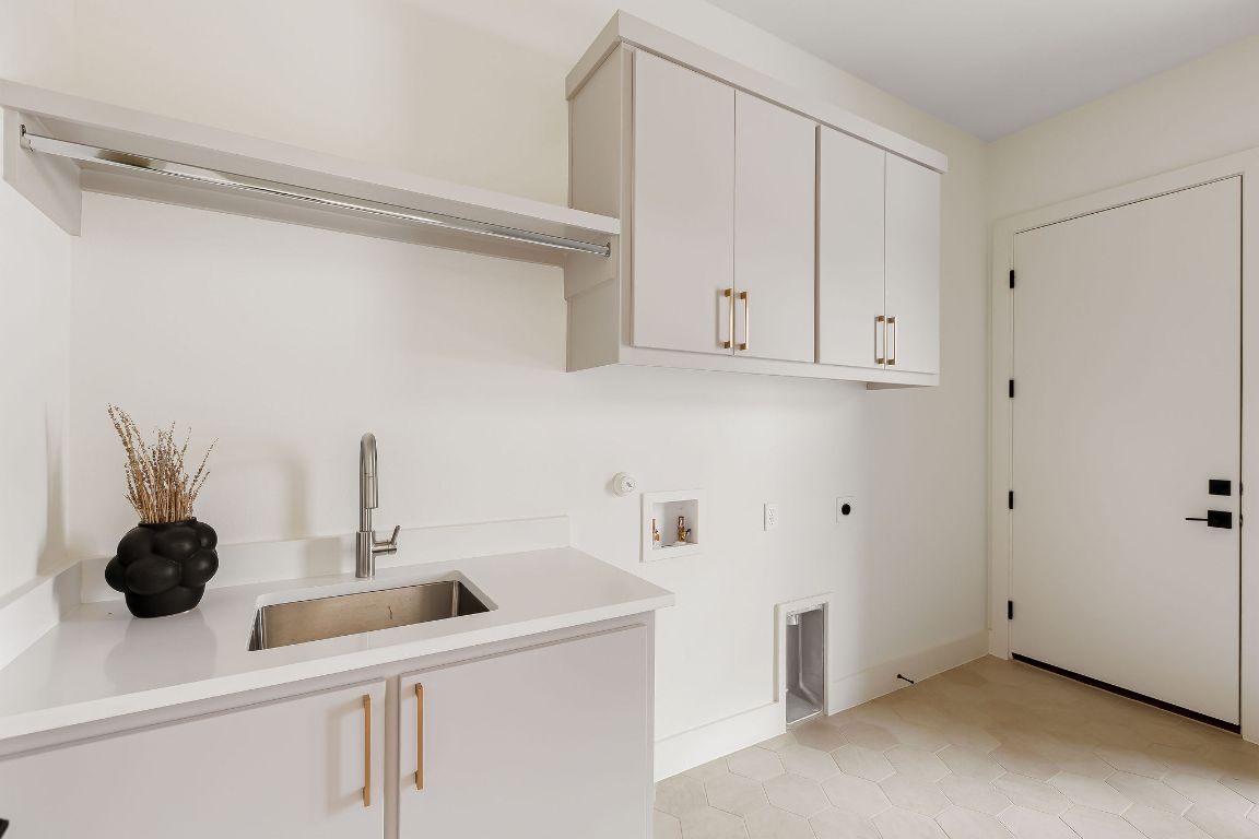 2607 Richcreek Road Austin, TX 78757 - Photo 33 of 40 a kitchen with a sink and cabinets
