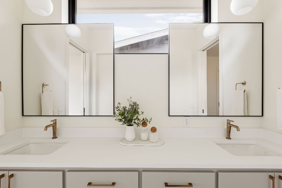 2607 Richcreek Road Austin, TX 78757 - Photo 38 of 40 a bathroom with a sink and a mirror