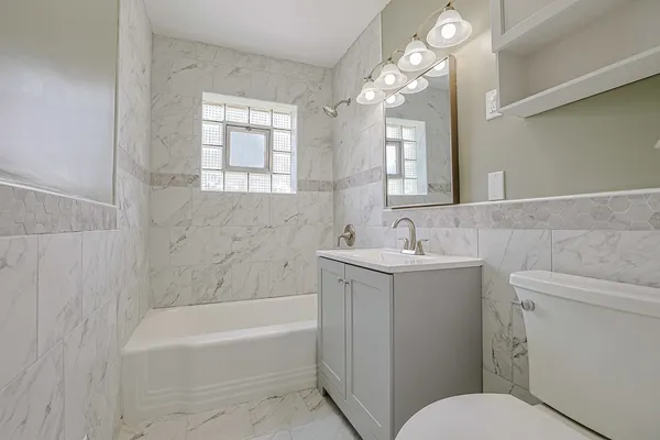 a bathroom with a sink toilet and bathtub