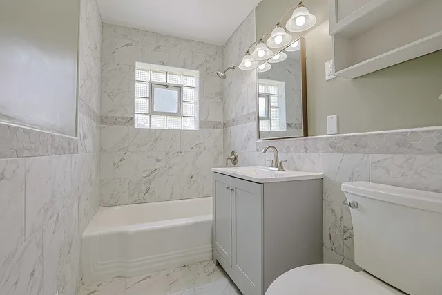 a bathroom with a sink toilet and bathtub