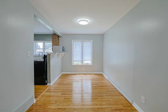 a view of a kitchen with a sink and a window