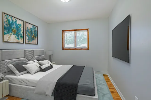 a bedroom with bed and a window