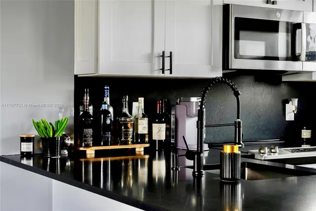 a kitchen with a table and chairs in it