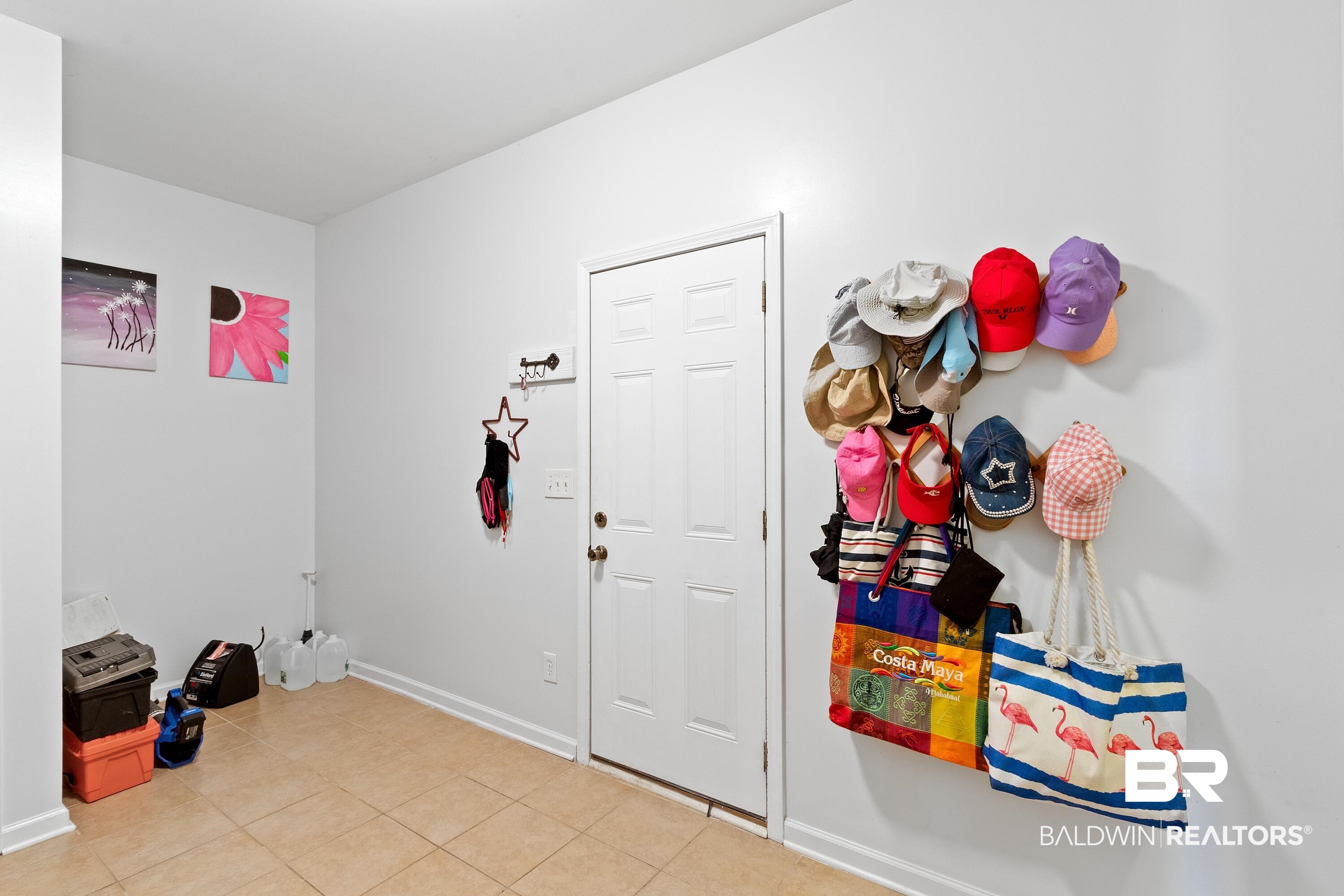 6846 Crimson Ridge Street Gulf Shores, AL 36542 - Photo 9 of 27 Mudroom entrance off of garage with storage and laundry