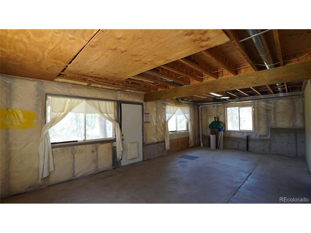 261 Wilkins Road Bailey, CO 80421 - Photo 19 of 39 a room with furniture and window
