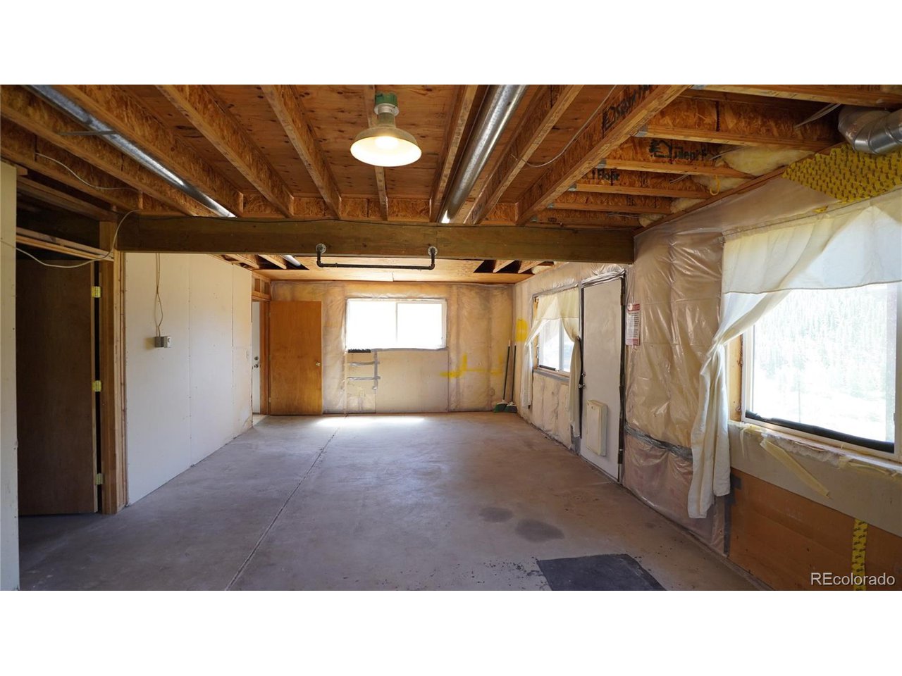 261 Wilkins Road Bailey, CO 80421 - Photo 22 of 39 a black and white photo of a room
