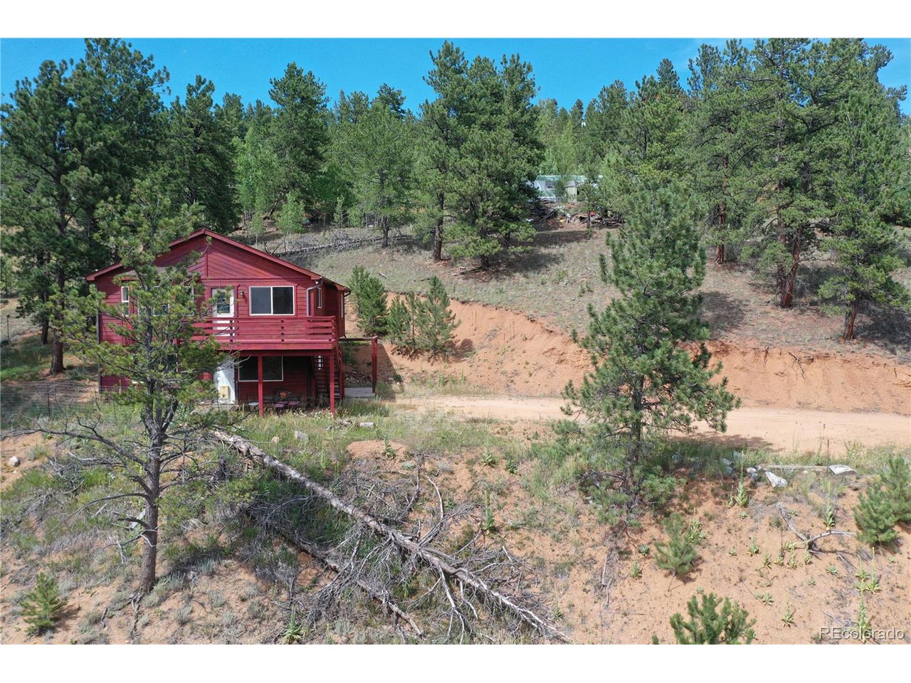 261 Wilkins Road Bailey, CO 80421 - Photo 27 of 39 a view of a house with a yard