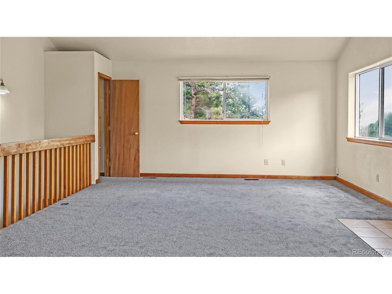 261 Wilkins Road Bailey, CO 80421 - Photo 7 of 39 a open hall with a couch