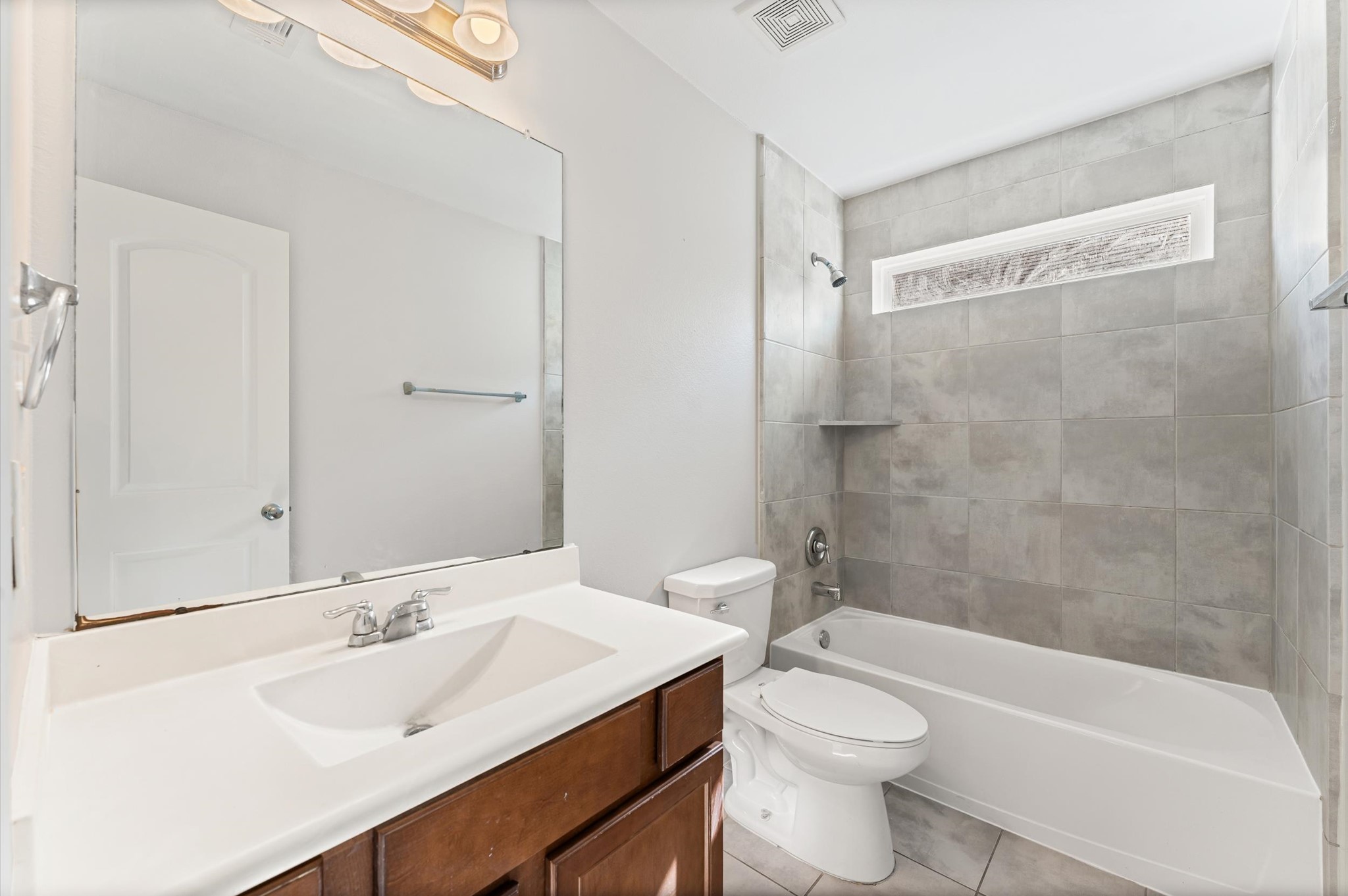 7018 Granite Terrace Lane Houston, TX 77083 - Photo 11 of 18 a bathroom with a sink a toilet and shower