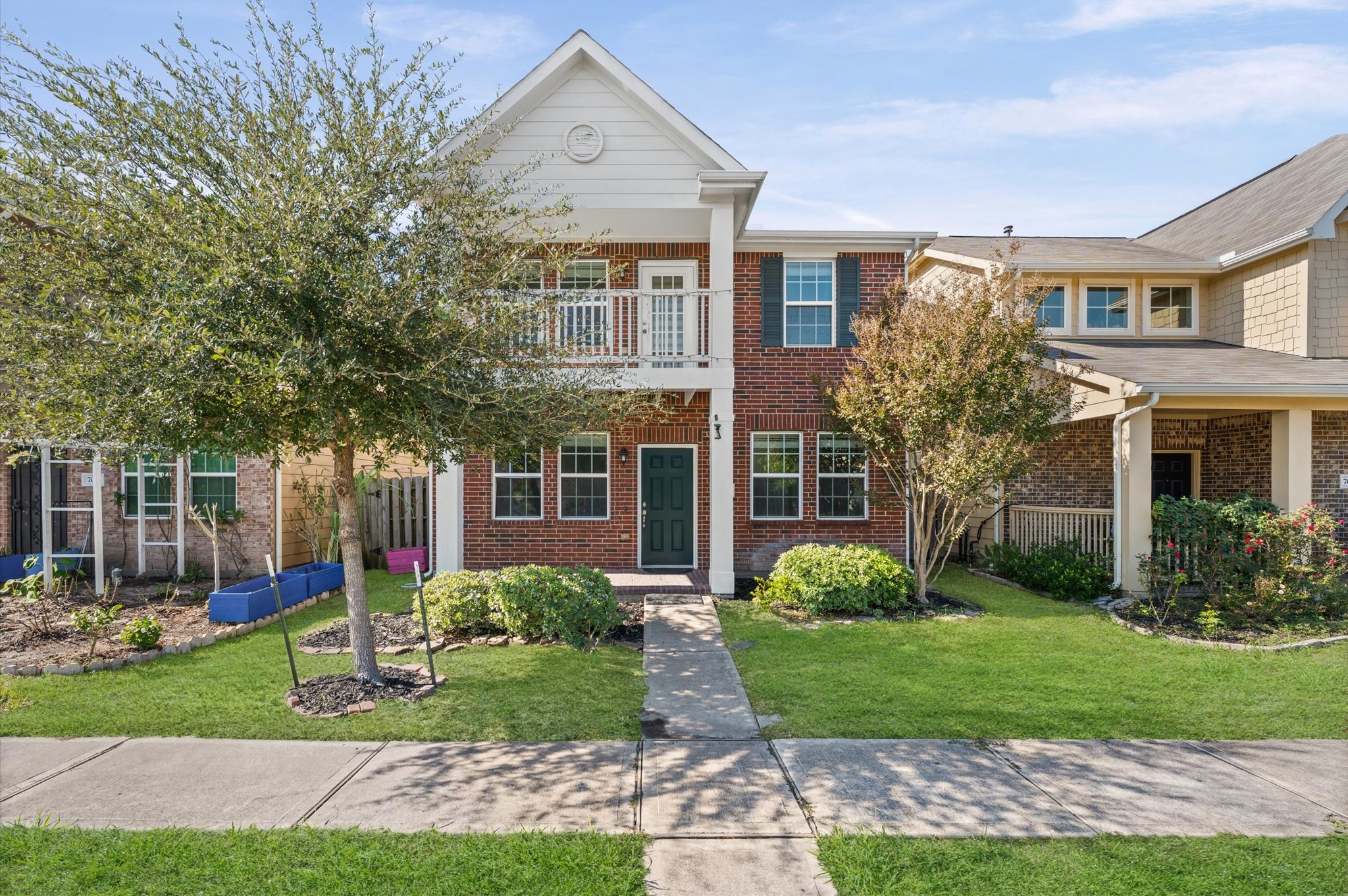 7018 Granite Terrace Lane Houston, TX 77083 - Photo 2 of 18 a front view of a house with garden
