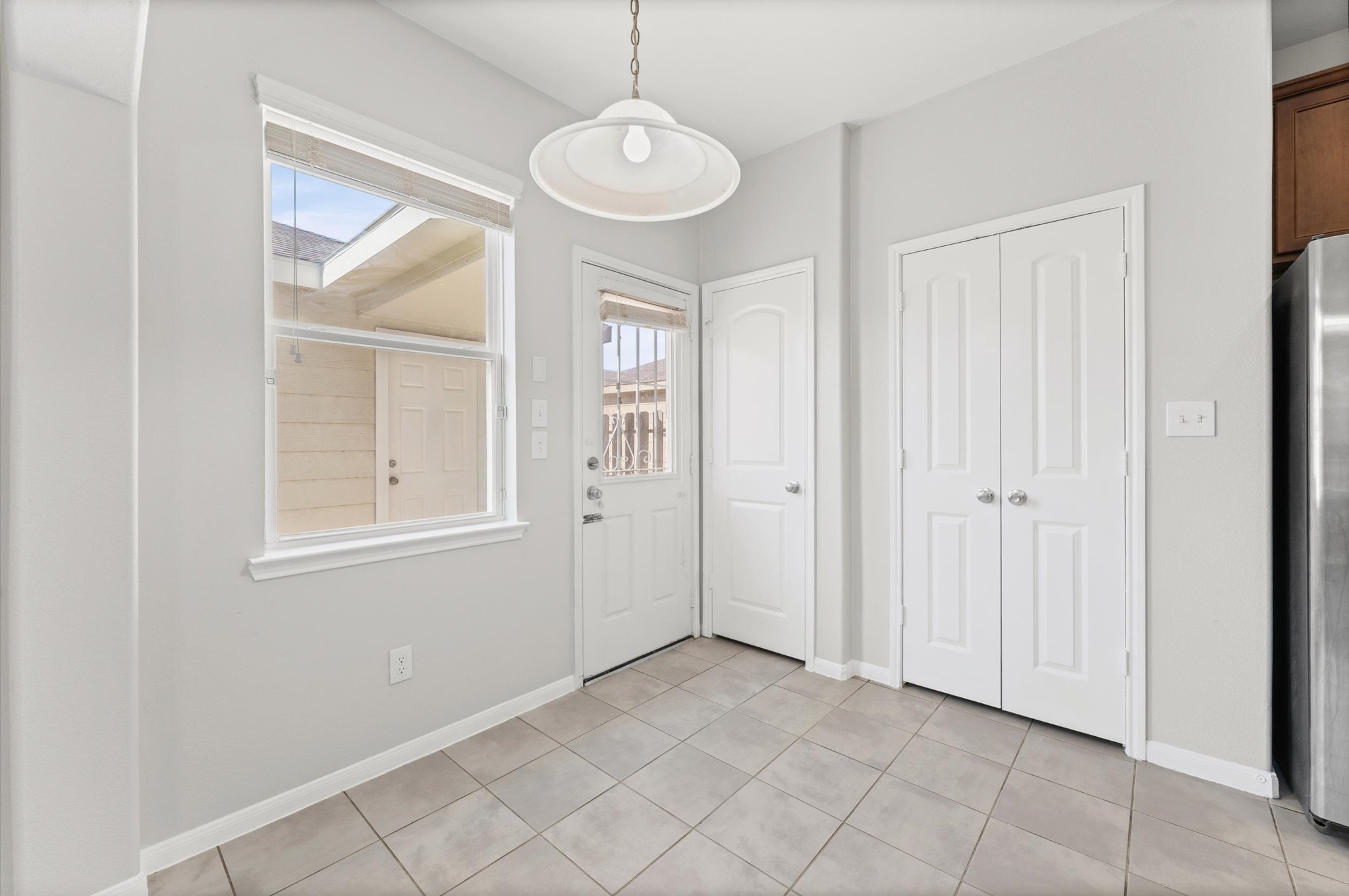 7018 Granite Terrace Lane Houston, TX 77083 - Photo 6 of 18 an empty room that has a window and wooden floor