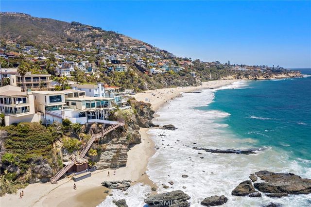 a bedroom with furniture and a large window