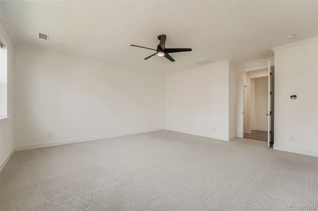 a bathroom with a granite countertop sink mirror and a bathtub