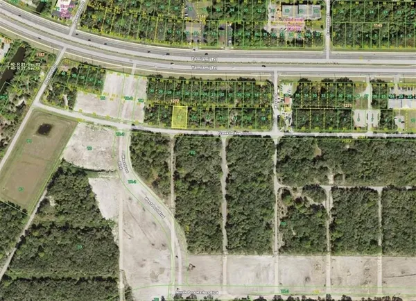 a view of a balcony with a yard