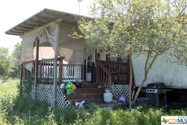 a house view with a garden space