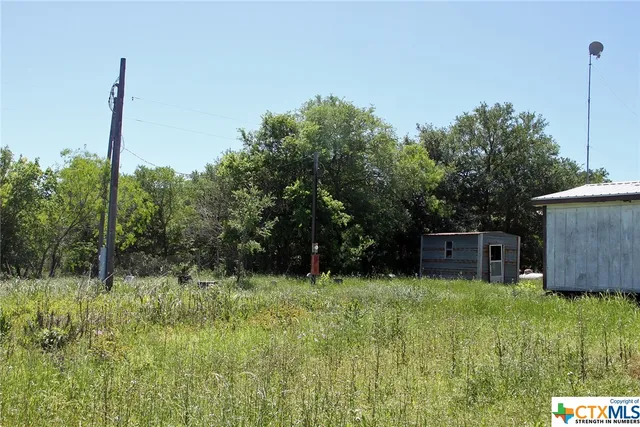 a view of a bathroom with a sink and mirror