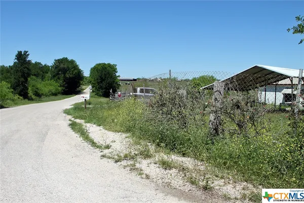 a view of lake with green space