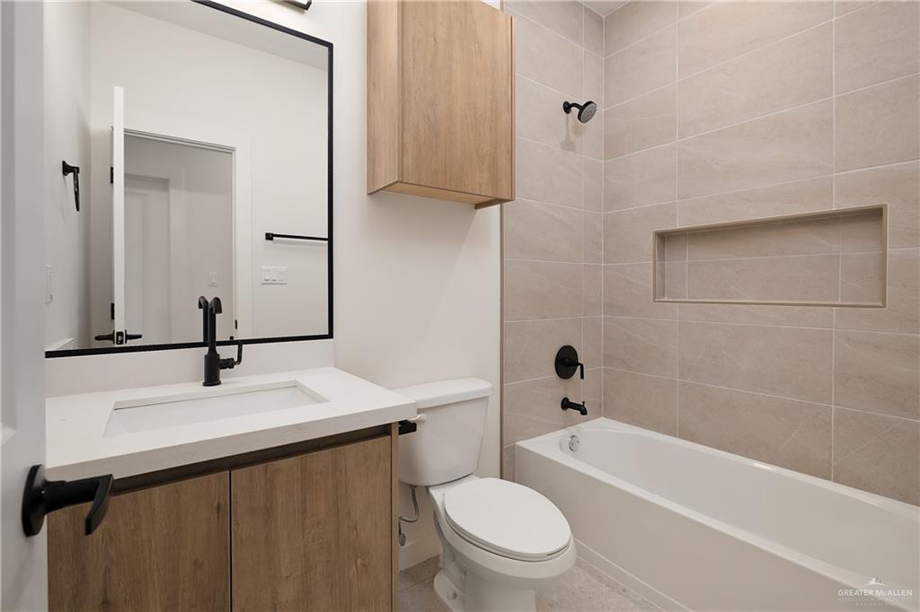 11501 North 25th Street, Unit 2 McAllen, TX 78504 - Photo 13 of 22 a bathroom with a sink a toilet and shower