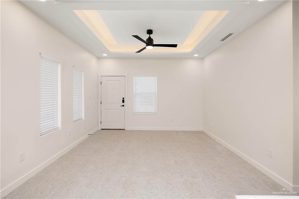 11501 North 25th Street, Unit 2 McAllen, TX 78504 - Photo 9 of 22 wooden floor in an empty room with a window