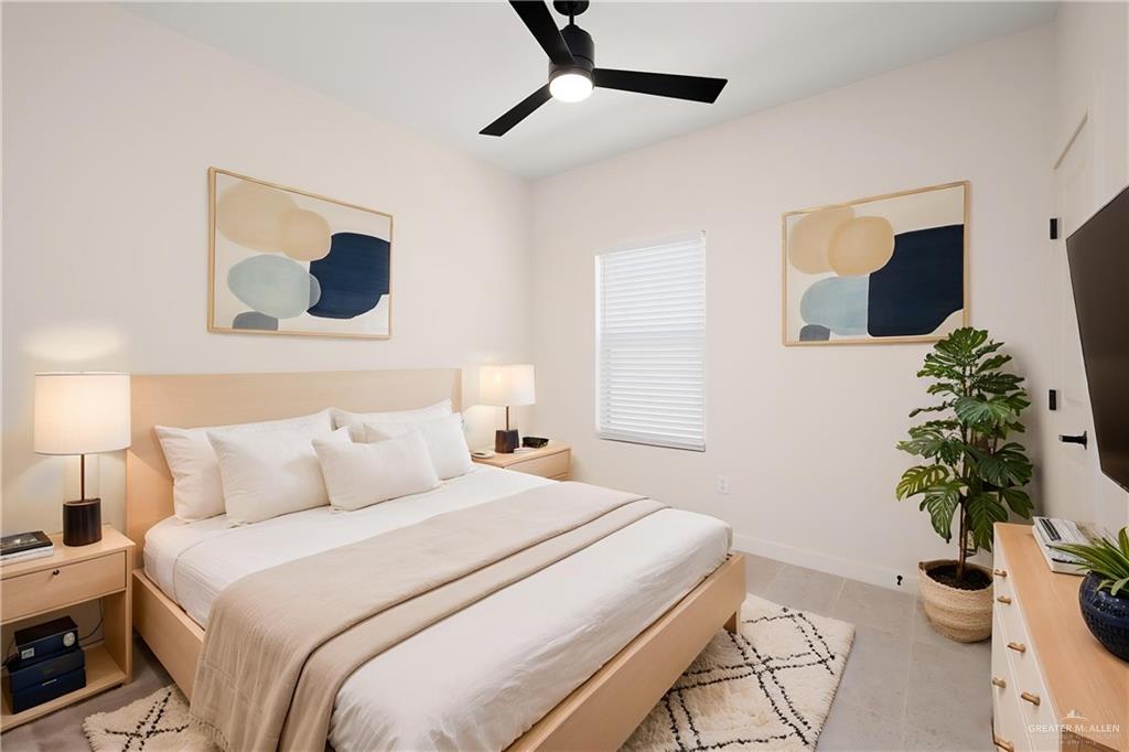 11501 North 25th Street, Unit 2 McAllen, TX 78504 - Photo 10 of 22 a bedroom with a bed and a potted plant