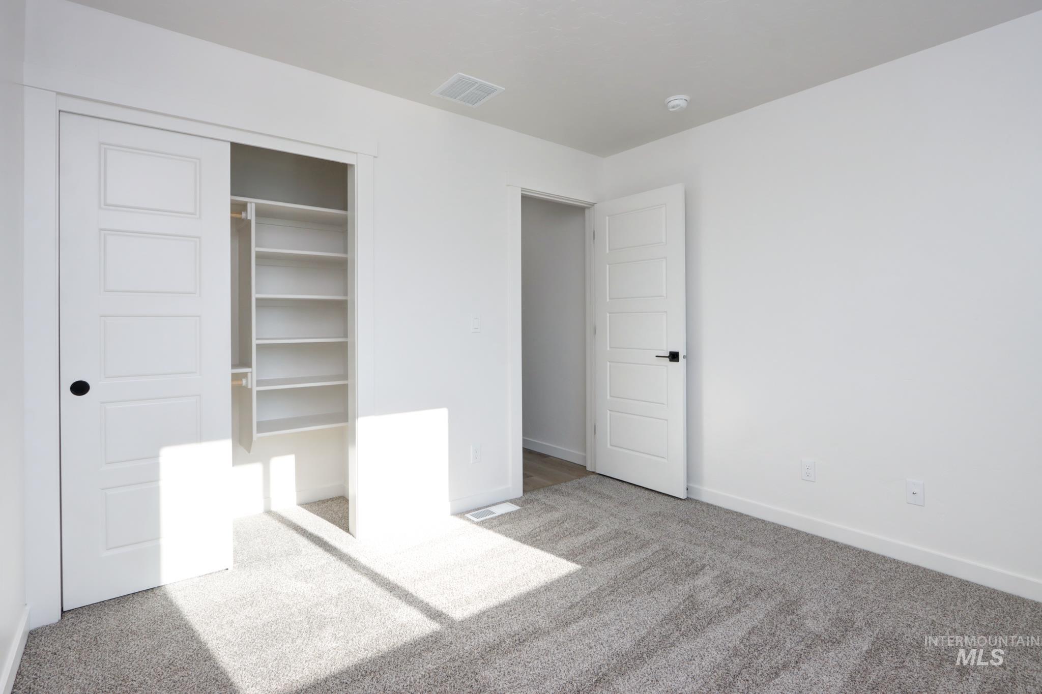 848 North 5th Street Nyssa, OR 97913 - Photo 26 of 49 Bedroom featuring neutral carpeting and white painted walls