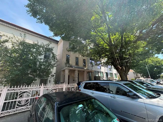 a view of a car park in front of a house
