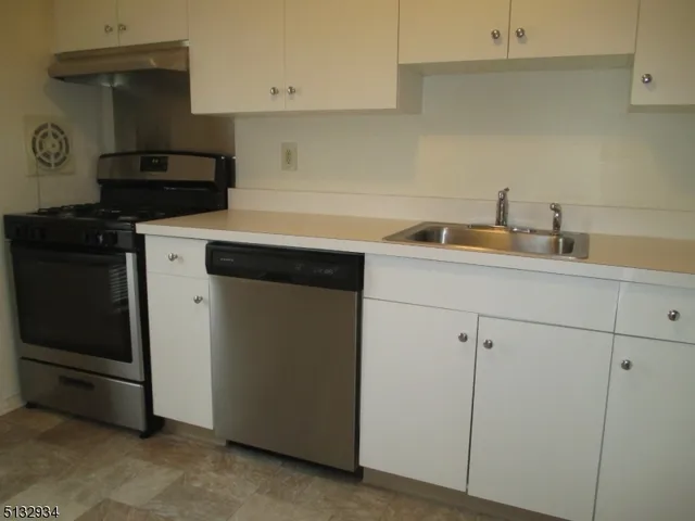 a view of a swimming pool with lounge chair