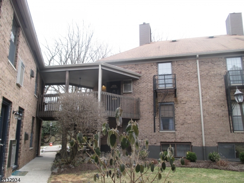 181 Long Hill Road, Unit 8 Little Falls, NJ 07424 - Photo 2 of 15 a front view of a house with large windows