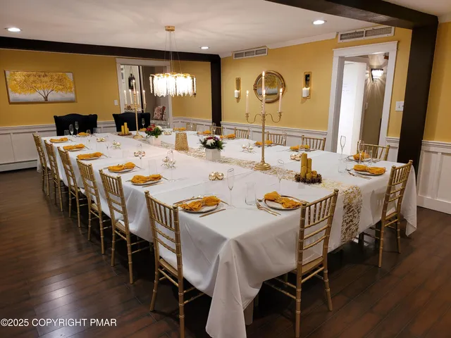 a view of a dining area with furniture and wooden floor