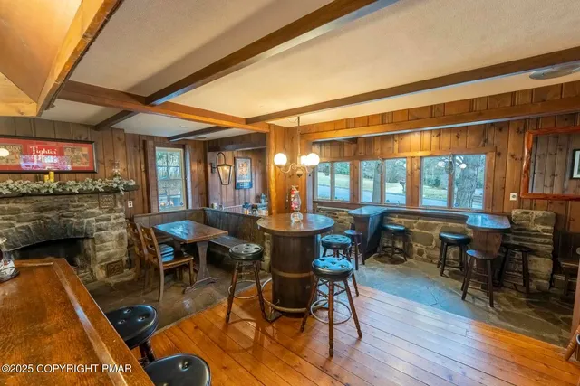 a room with lots of chairs and mirrors