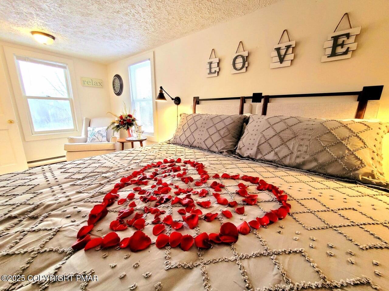 2735 Highway 390 Canadensis, PA 18325 - Photo 16 of 55 a bedroom with a large bed and wooden floor