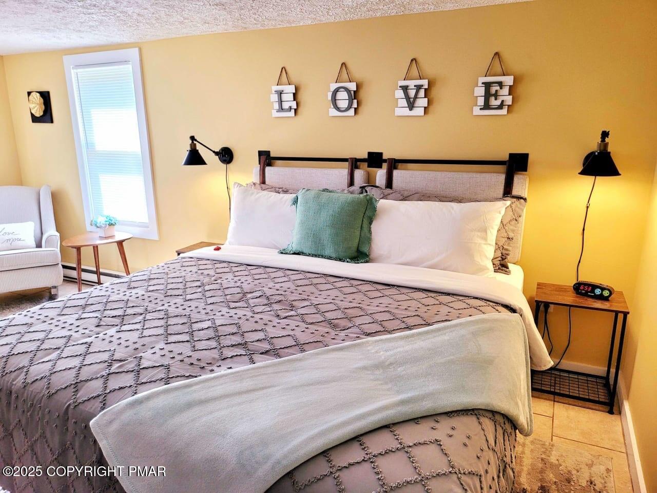 2735 Highway 390 Canadensis, PA 18325 - Photo 18 of 55 a bedroom with a bed and wooden floor