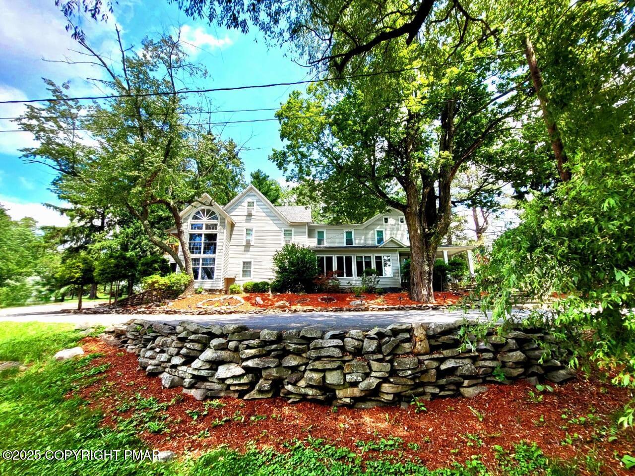 2735 Highway 390 Canadensis, PA 18325 - Photo 2 of 55 a front view of a house with a yard
