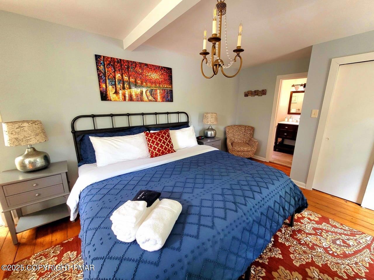 2735 Highway 390 Canadensis, PA 18325 - Photo 21 of 55 a bed sitting in a bedroom next to a window