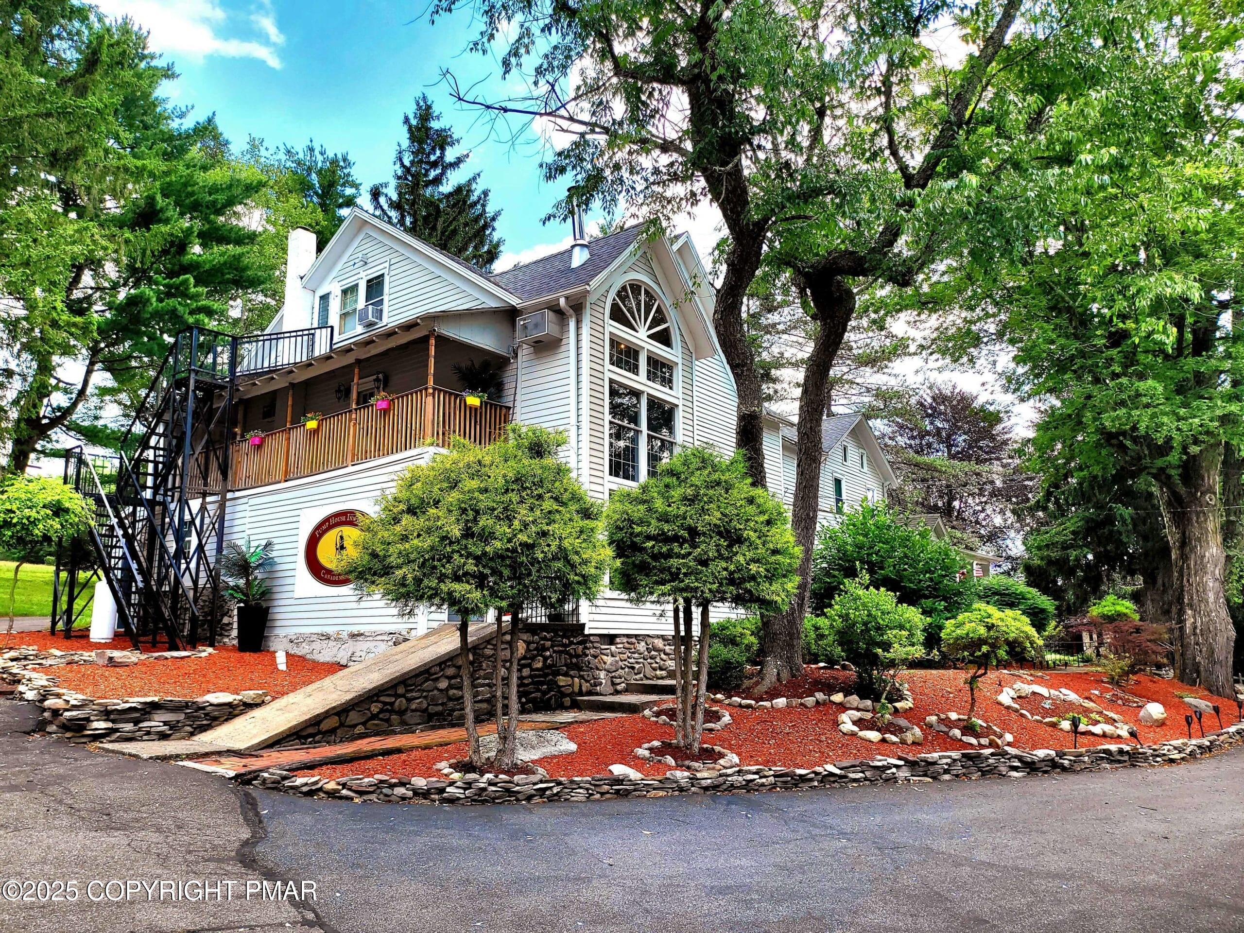 2735 Highway 390 Canadensis, PA 18325 - Photo 26 of 55 a front view of a house with outdoor space