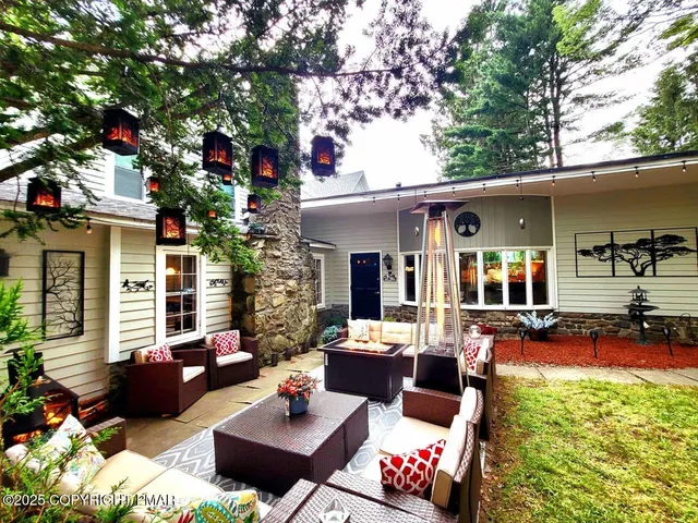 a outdoor living space with furniture and a potted plant