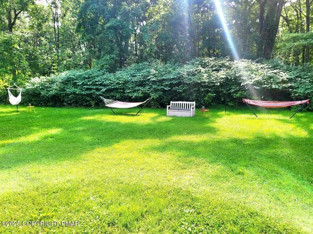 a garden view with a sitting space