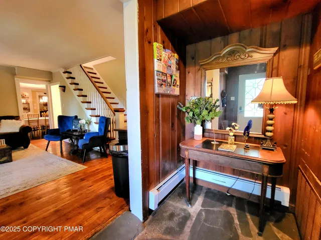 a room with musical instrument pool table and chairs