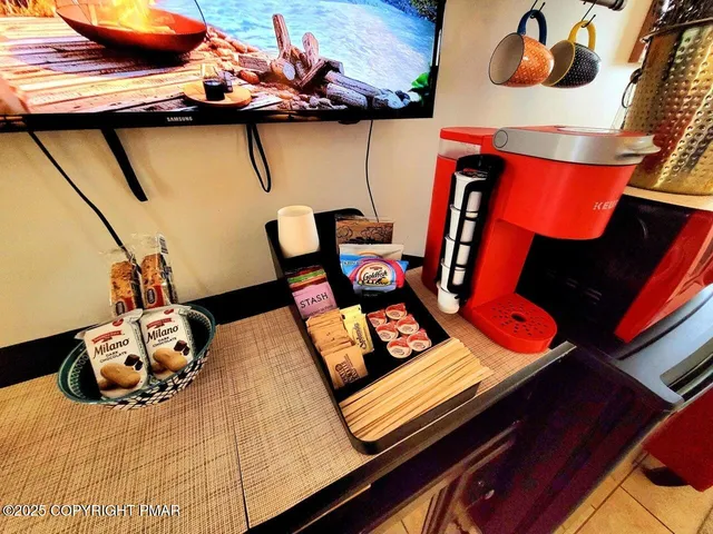 a bedroom with a bed and wall painting