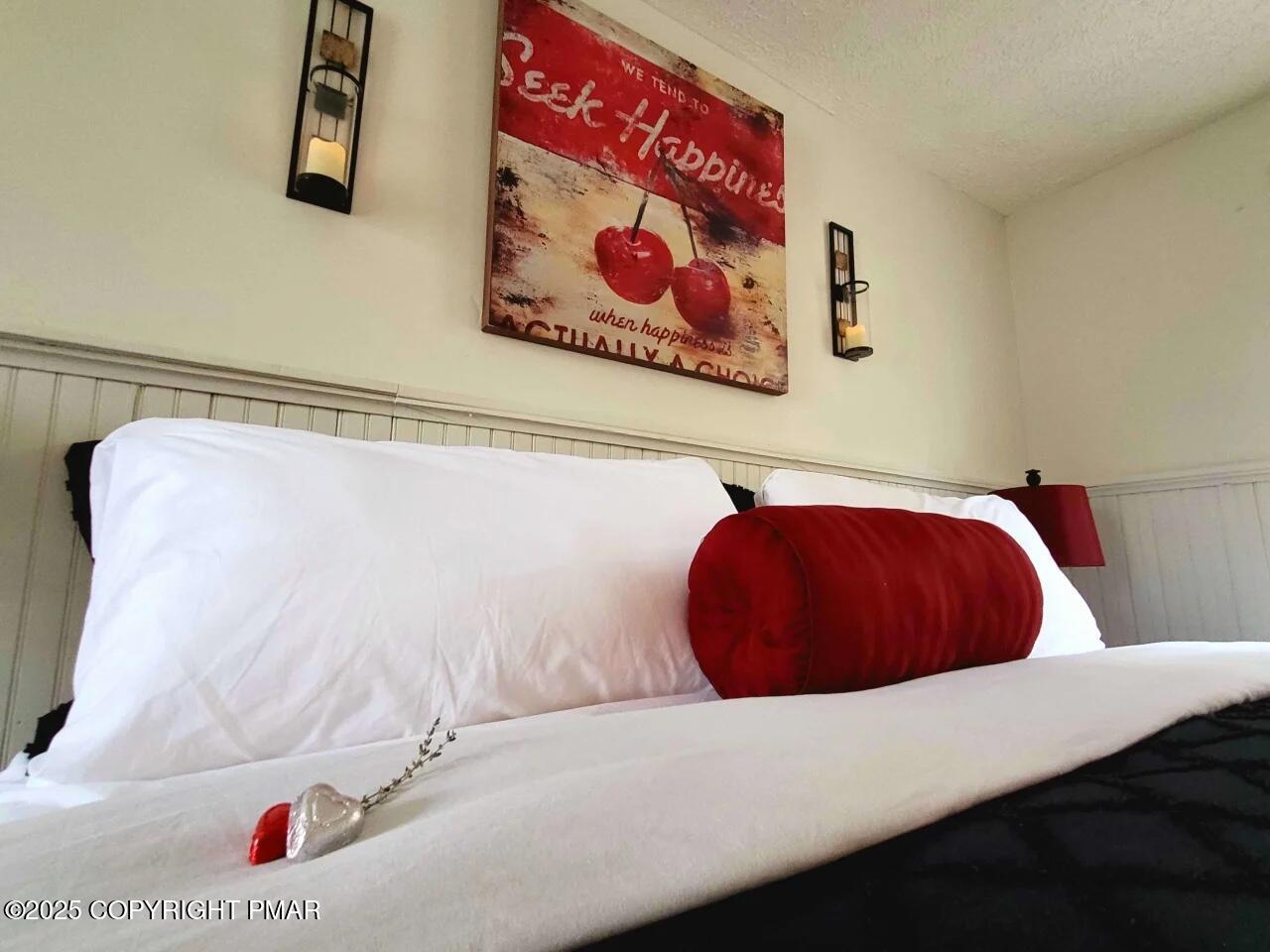 2735 Highway 390 Canadensis, PA 18325 - Photo 38 of 55 a bedroom with a bed and wall painting